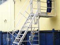 Telescopic platform ladder with outreach