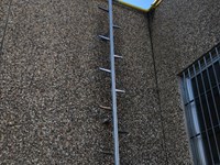 Fixed ladder with rail and fall protection