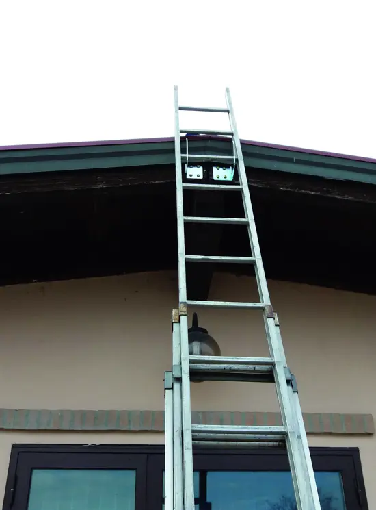Wall-mounted ladder hook