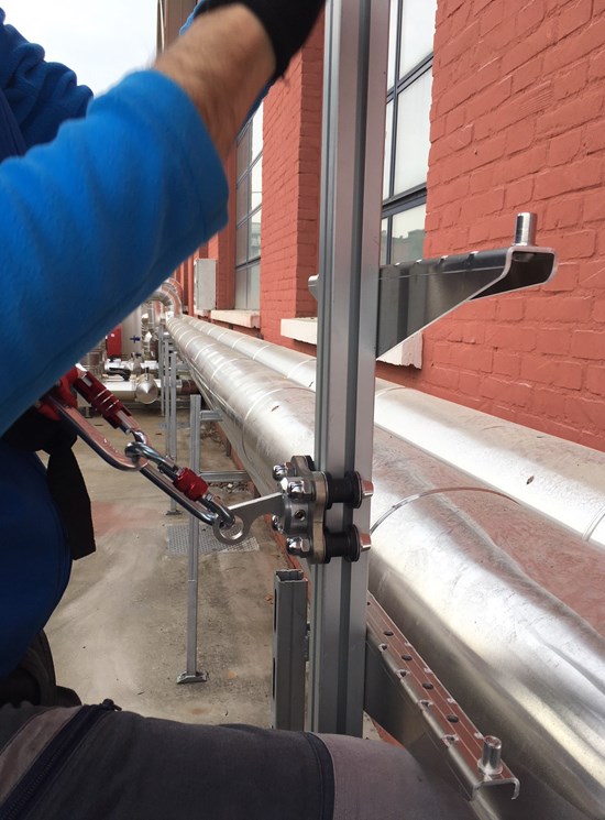 Fixed ladder with rail and fall protection